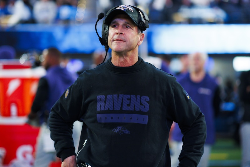 Former Ravens head coach John Harbaugh signs with the giants.