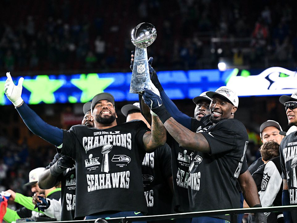 The Seattle Seahawks hoist the Lombardi Trophy after Super Bowl LX.