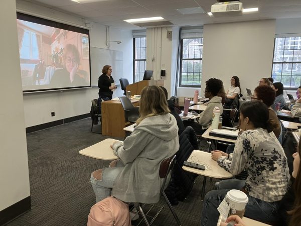 Eloisa James (left) and Karen Dukess (right) speak with Fordham students about their short stories.