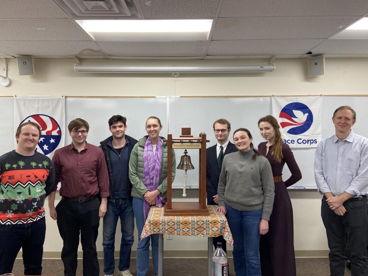  Returned Peace Corps volunteers who told their stories, standing with the Dorothy Marinucci Bell.