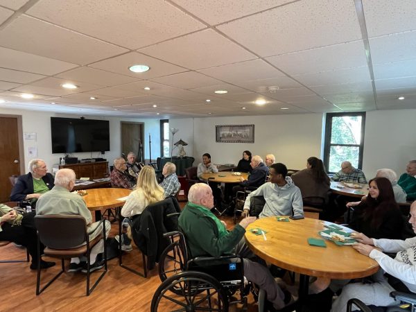 Residents of Murray-Weigel Hall and Fordham students listening to Irish-themed music.
