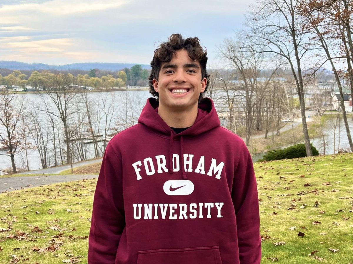 Anthony Sanchez, FCRH '29, posing for his Fordham commitment photo. 