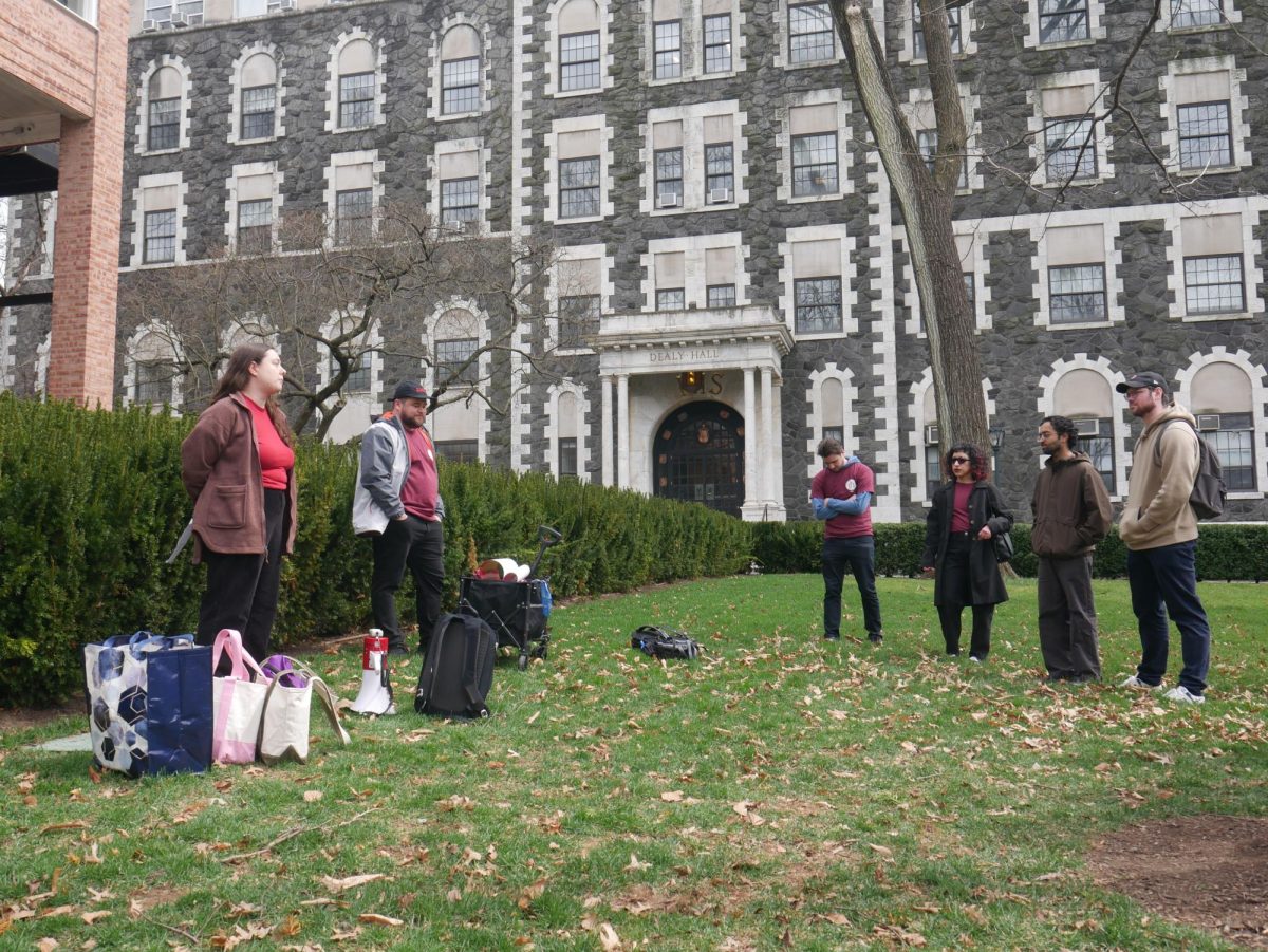 Fordham Graduate Student Workers, among others, petitioned outside of Cunniffe House.